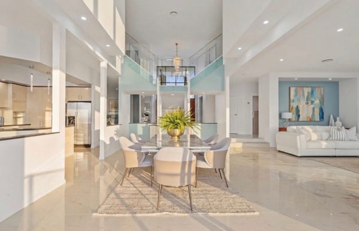 Vacant styling — foyer and dining with marble floor