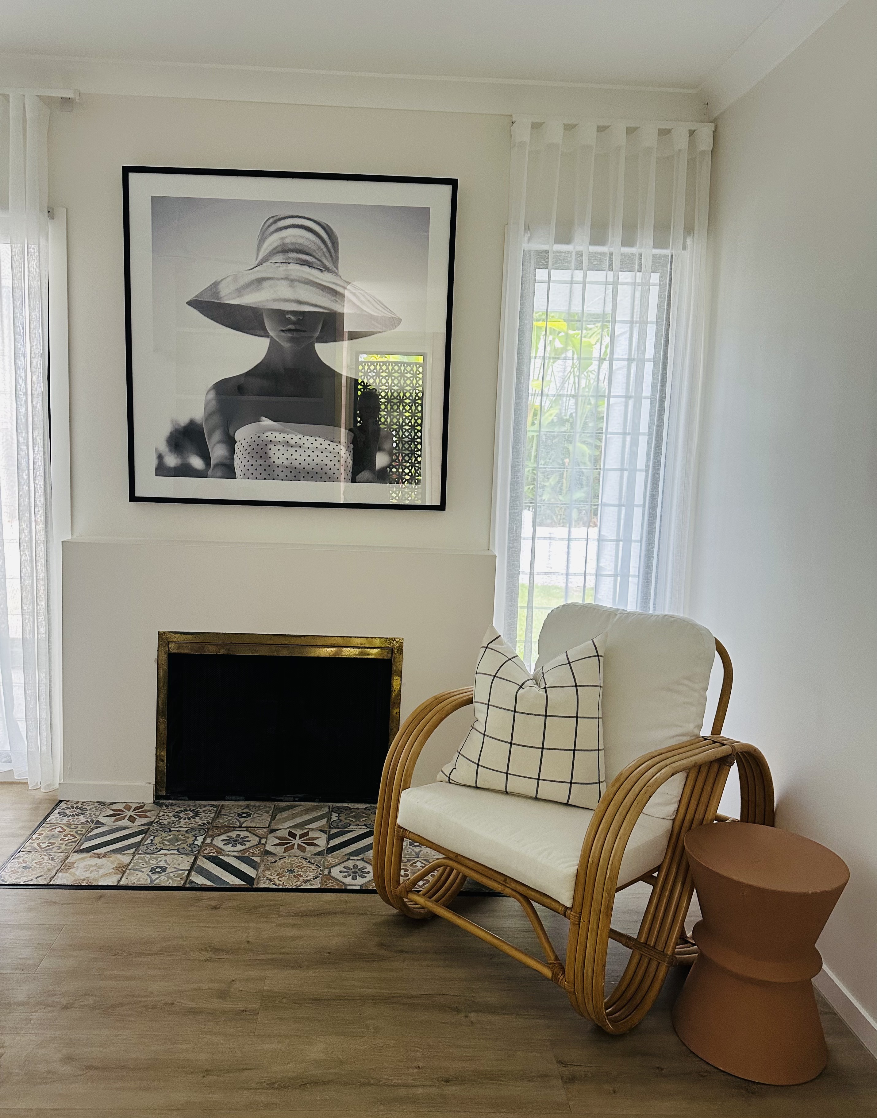 Occupied styling — fireplace nook with rattan chair
