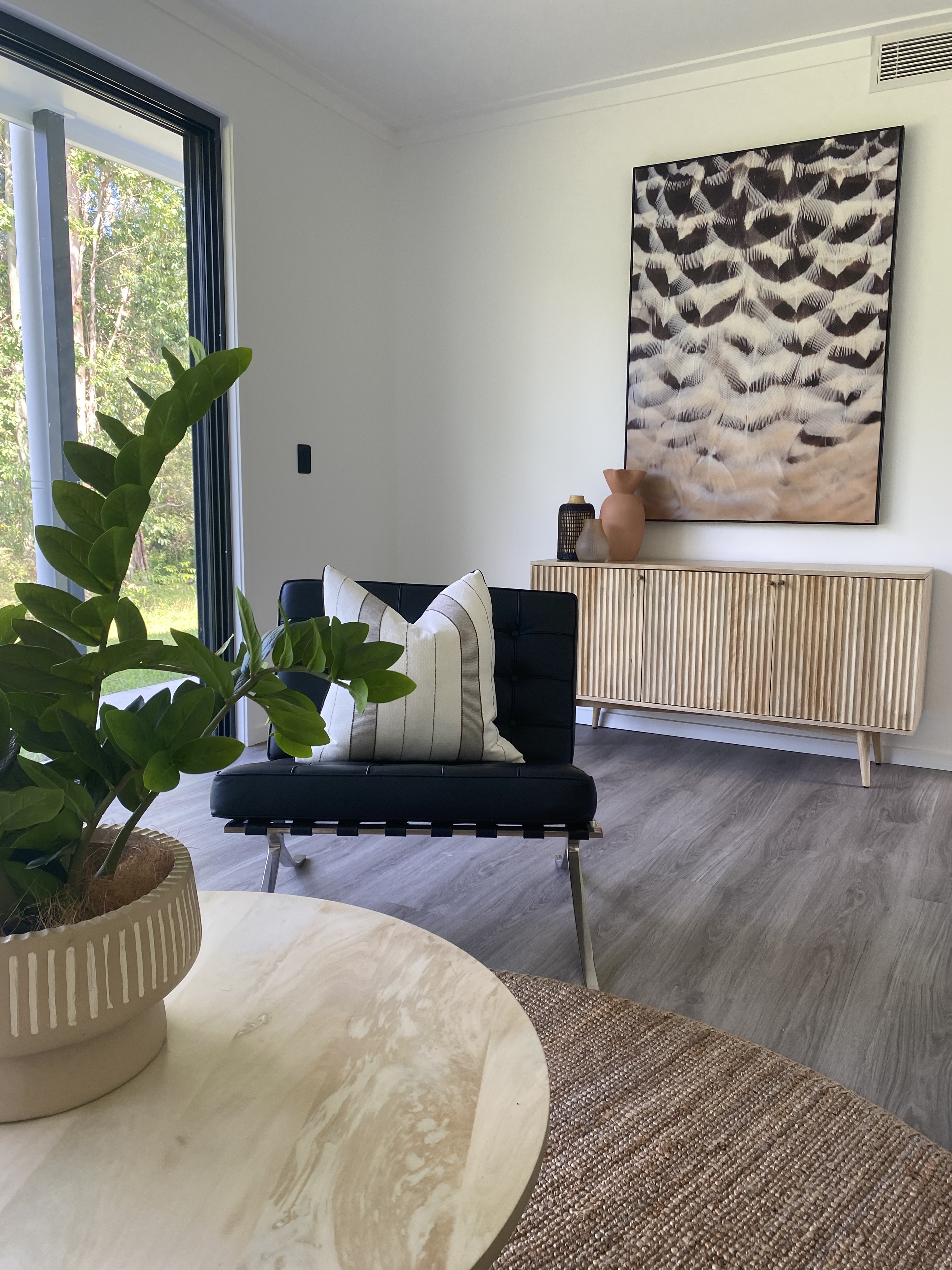 Interior design — Barcelona chair and fluted sideboard