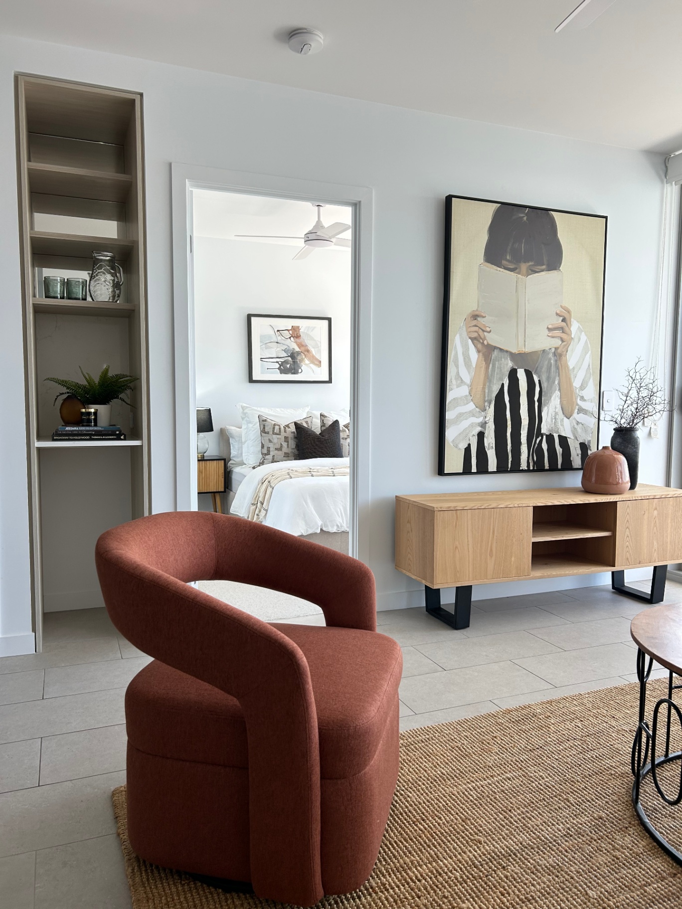 Occupied styling — living room with rust swivel chair