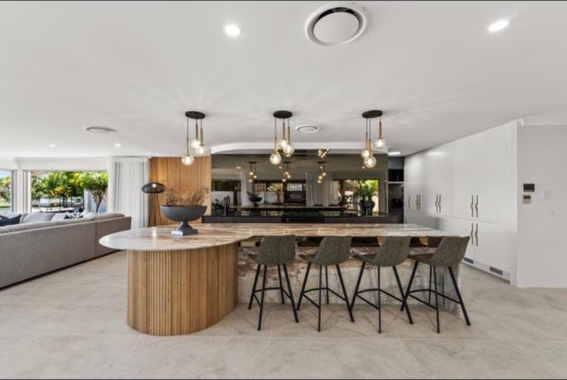 Interior design — fluted kitchen island with leather stools