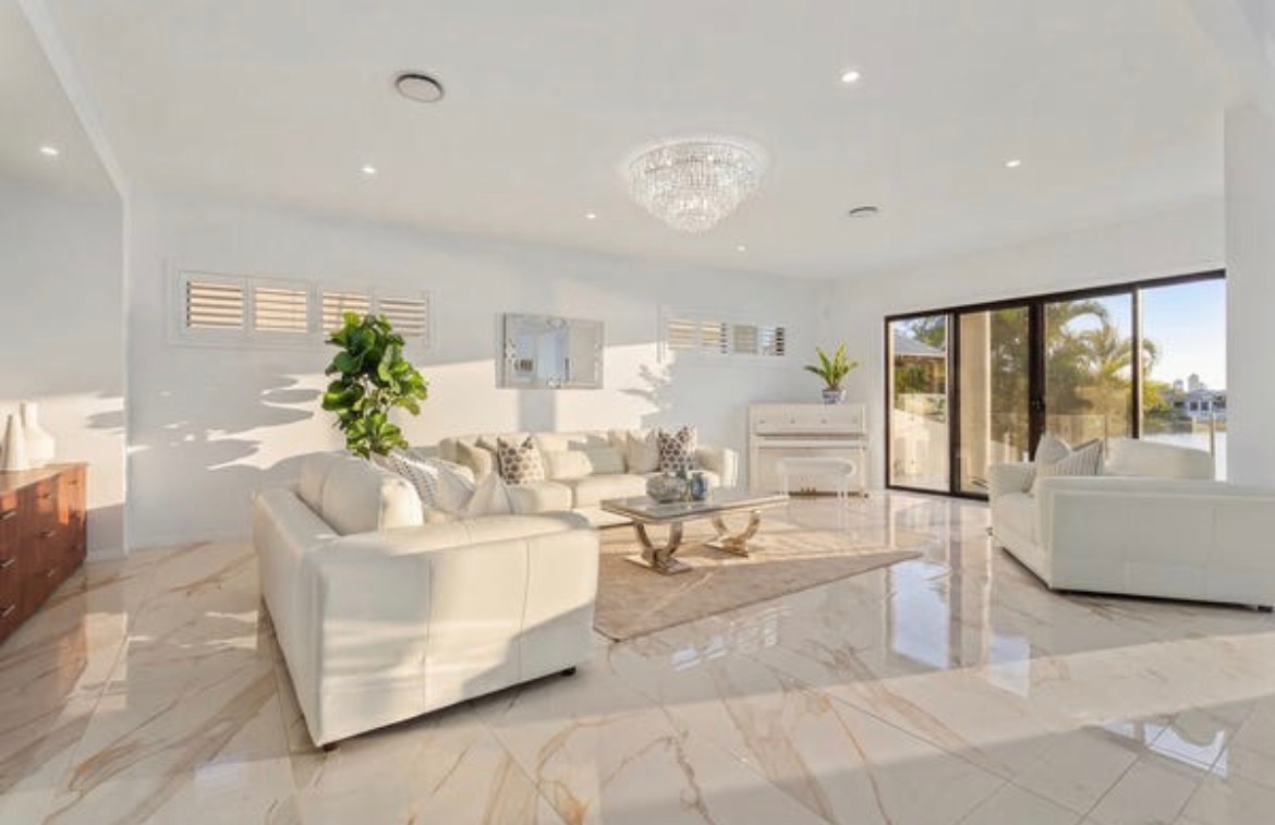 Vacant styling — living room with chandelier
