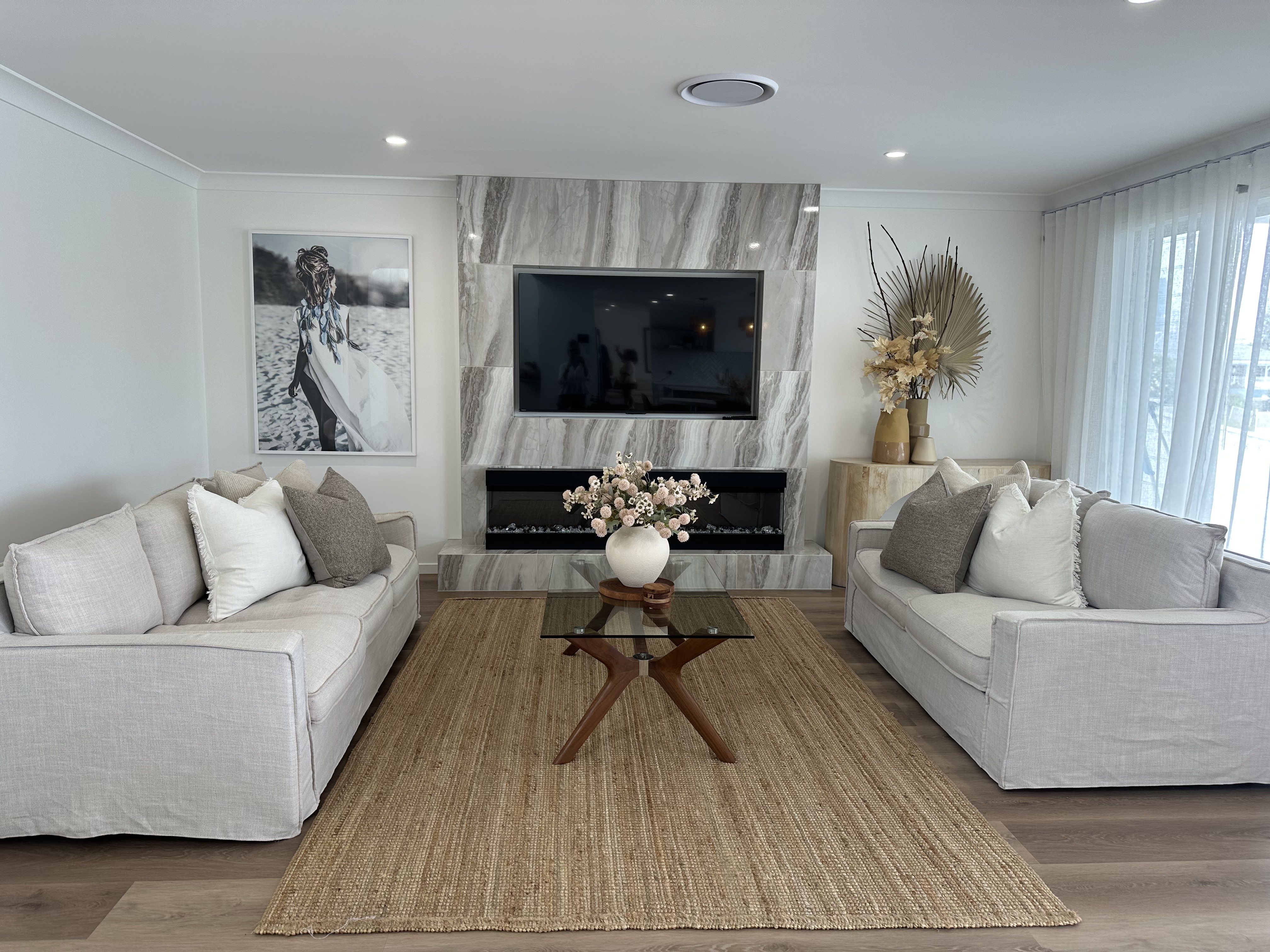 Occupied styling — stone-fireplace living room