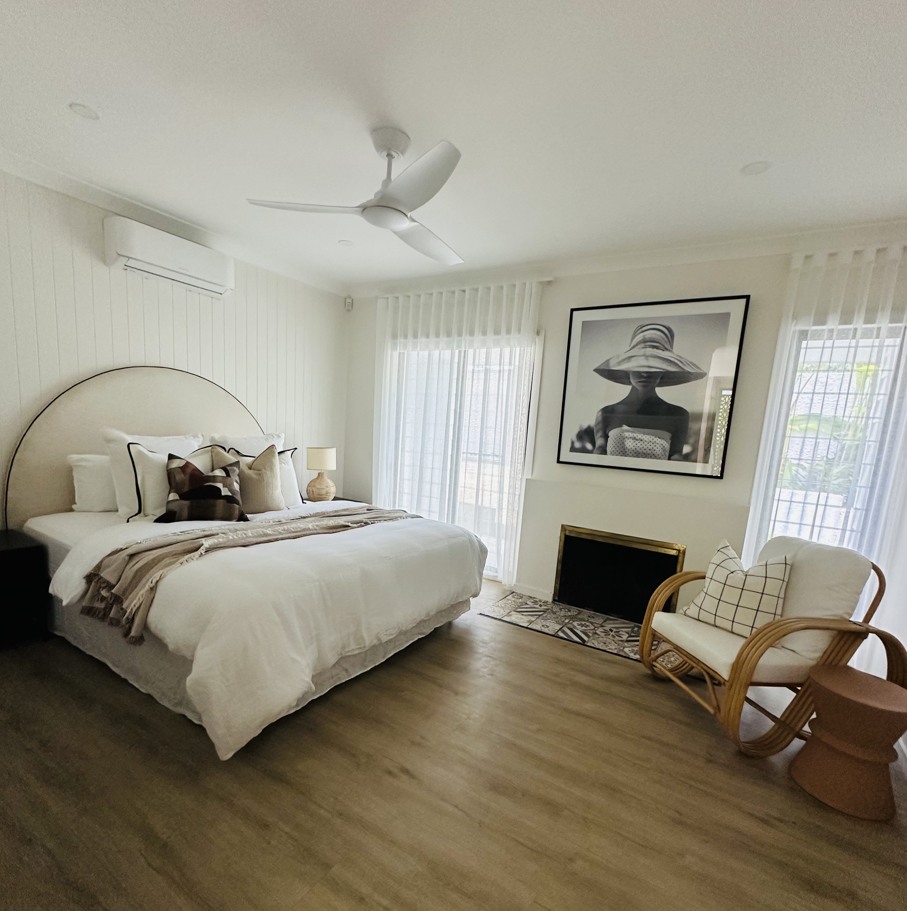 Occupied styling — arched-bedhead bedroom