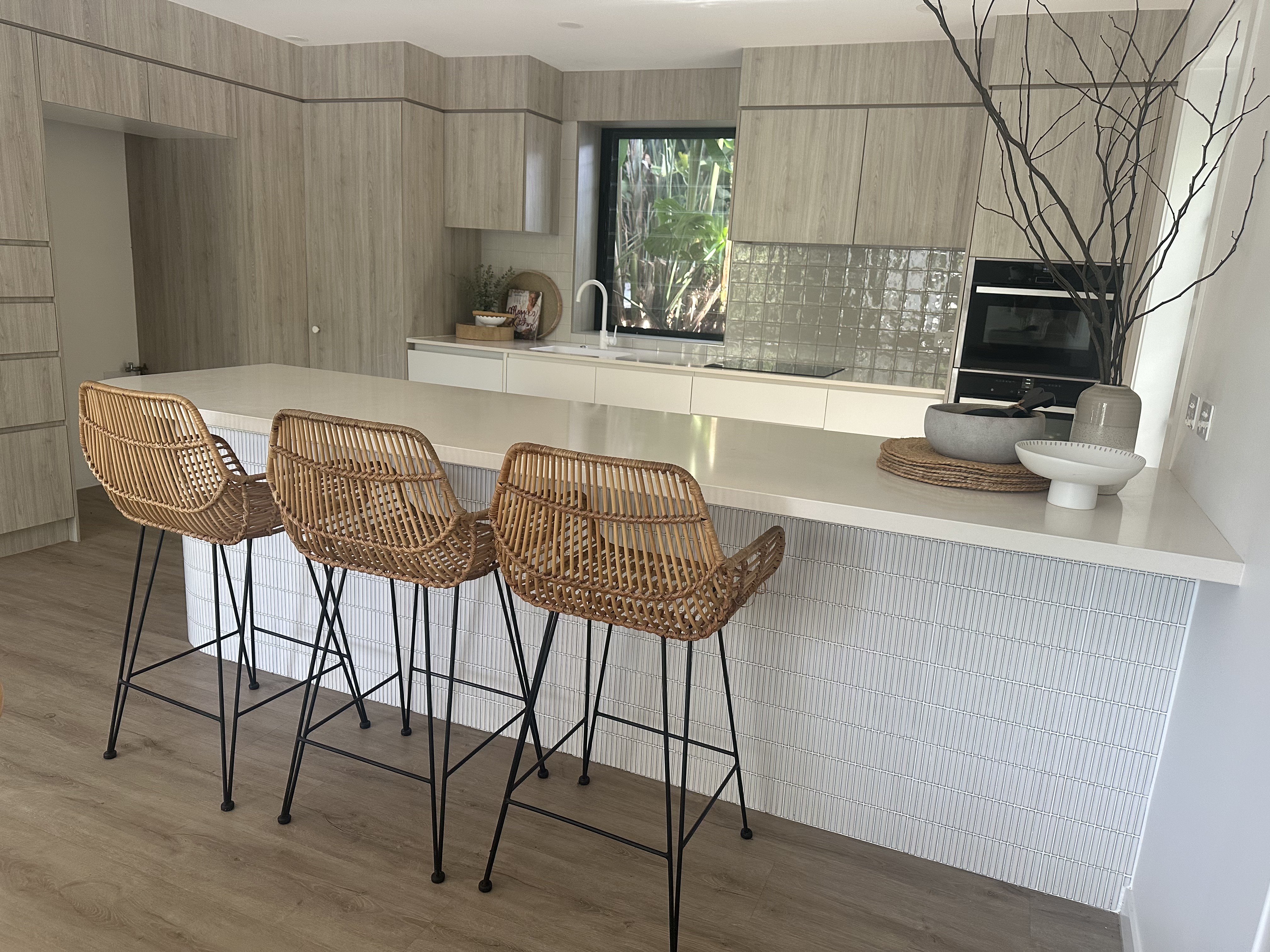 Vacant styling — kitchen with rattan bar stools